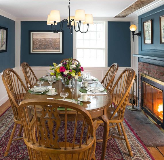 Dining room with fireplace at our bed and breakfast in Kennebunkport