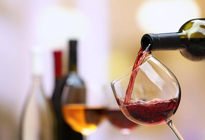 Red wine being poured into a glass at our B&B in Kennebunkport