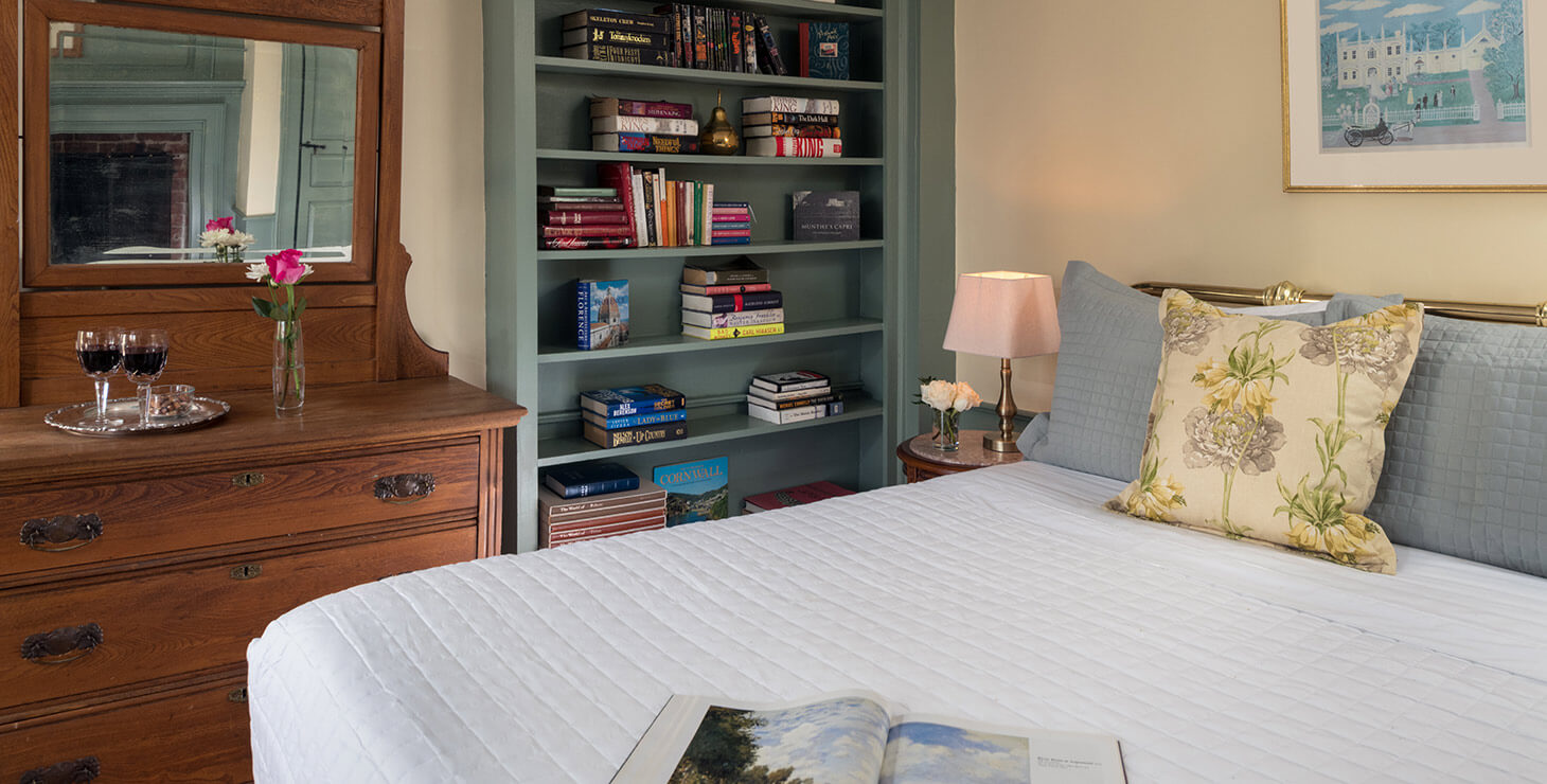 ralphs library bed and fireplace at our bed and breakfast in kennebunkport