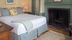 Ralph's Library bed and fireplace at our Kennebunkport B&B