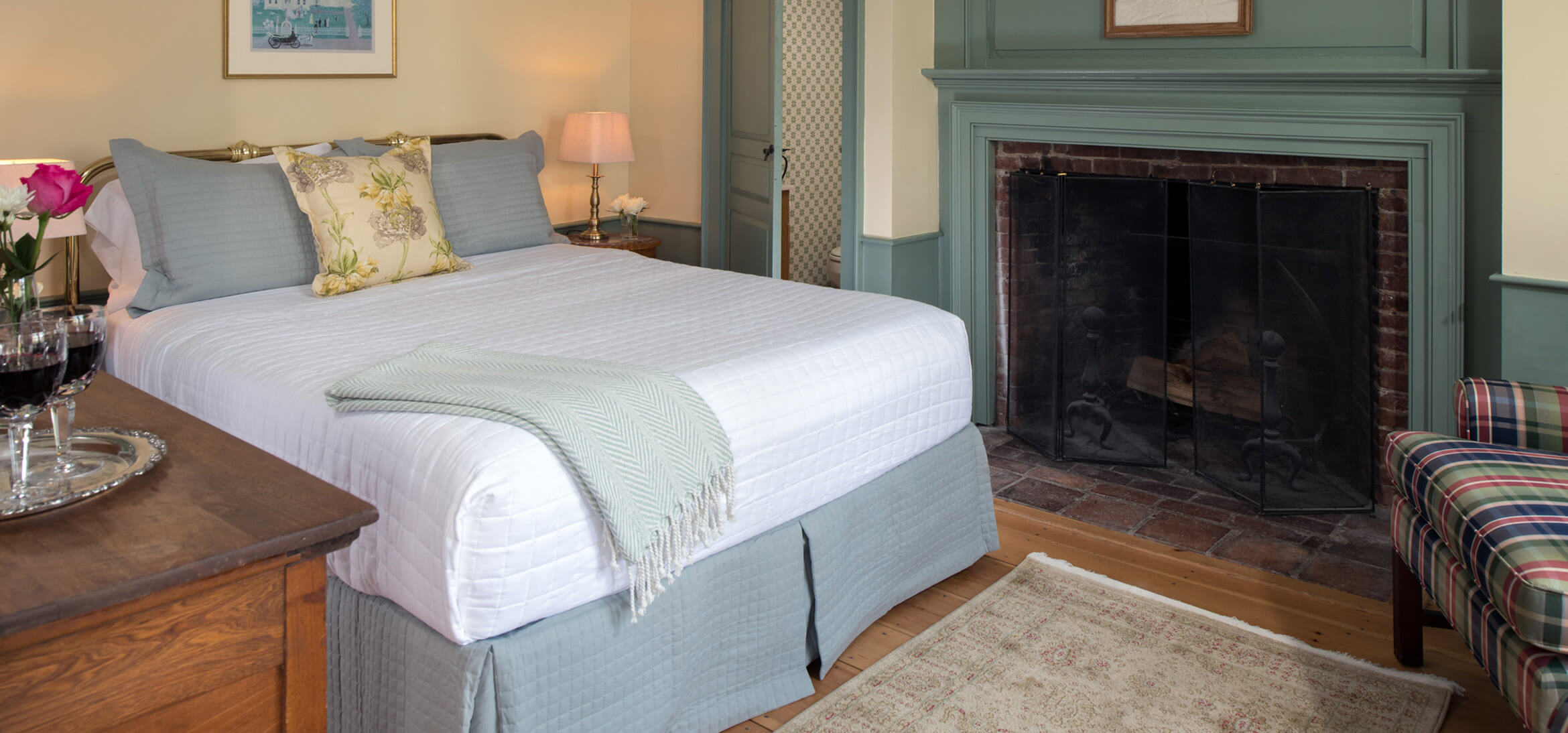 Ralph's Library bed and fireplace at our Kennebunkport B&B