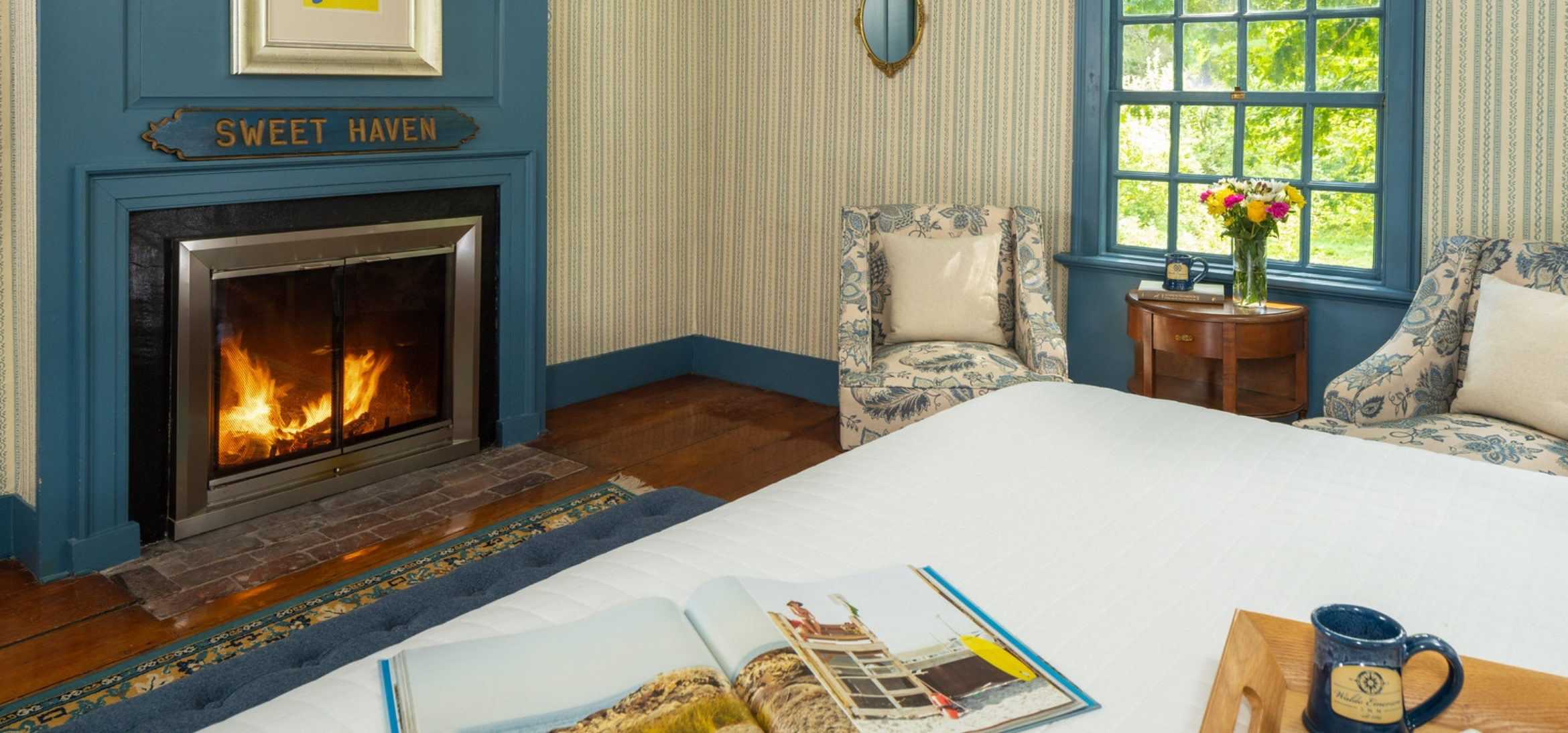 Sweet Haven Room bed, chairs and fireplace at our Kennebunkport, Maine B&B