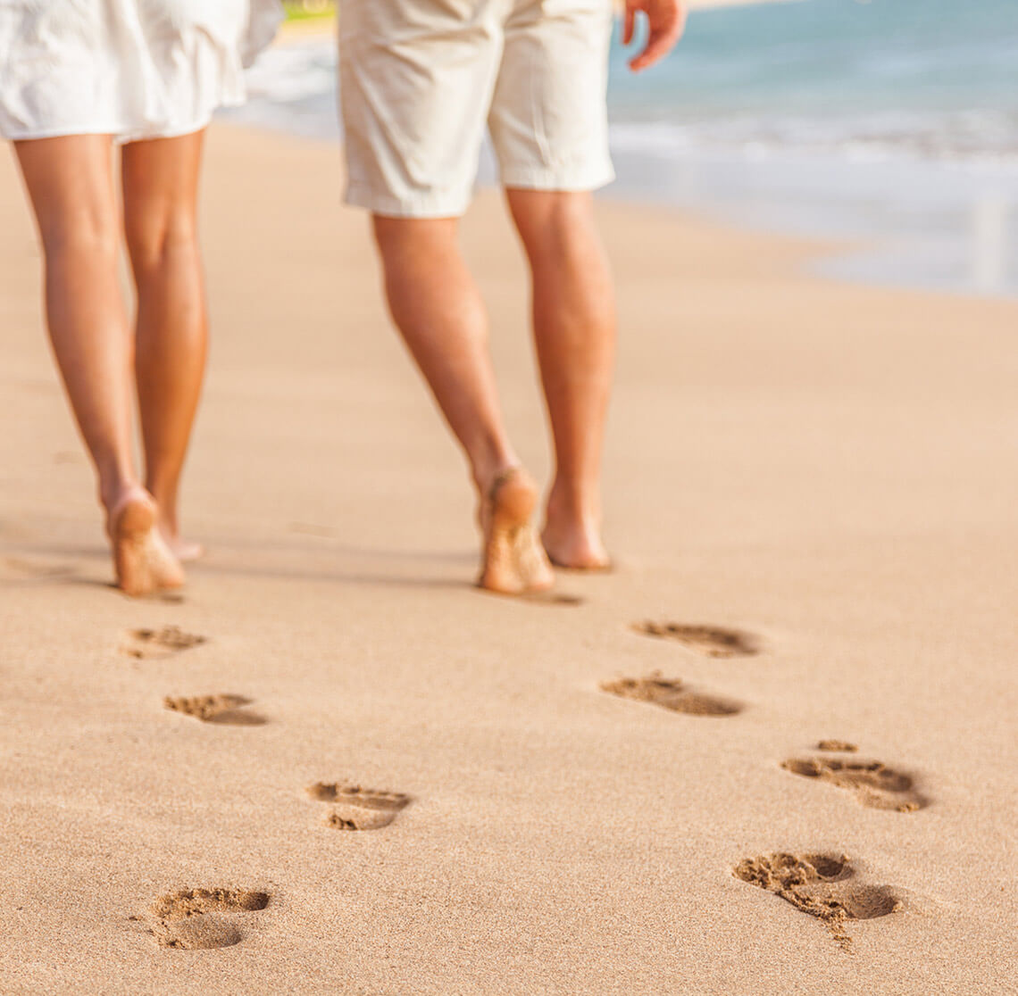 Couple walking on a beautiful Kennebunkport beach