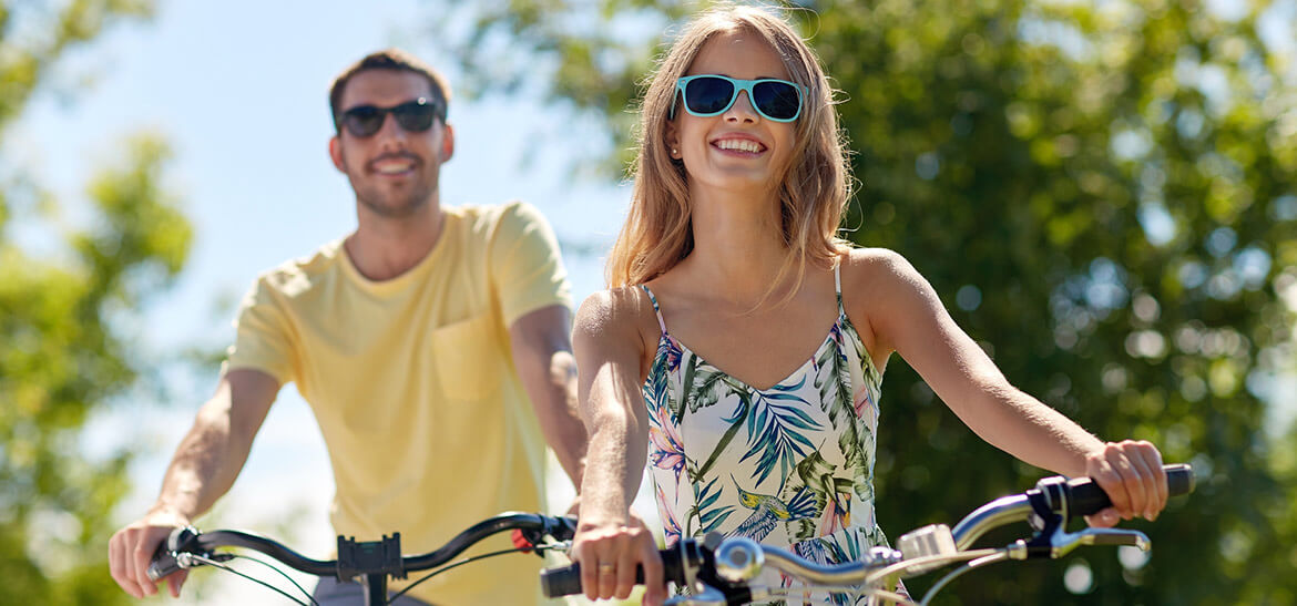 Happy couple biking together in Kennebunkport