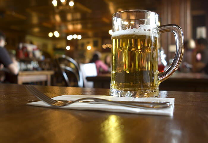 Glass of beer on a table at a restaurant